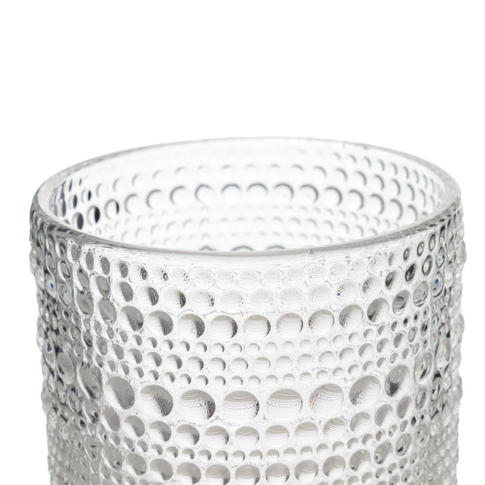 Clear glass with textured pattern on a white background