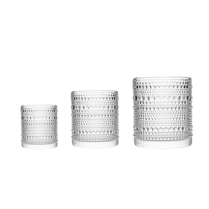 Three clear jupiter glass tumblers of different sizes on a white background