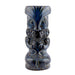 Decorative tiki mug with blue and black design on a white background