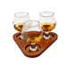 Three sniffer glasses on a cherry stain wooden tray with a white background