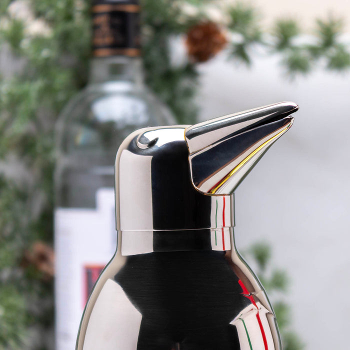 Penguin-shaped cocktail shaker with a blurred background