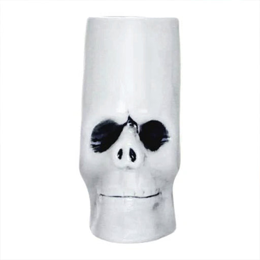 Skull-shaped mug with black eye sockets on a white background