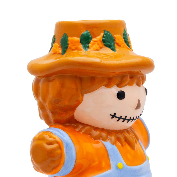 Scarecrow-themed ceramic mug with a white background