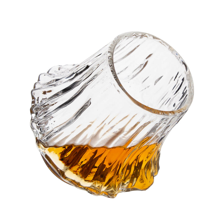 volcano-shaped glass filled with amber liquid on a white background