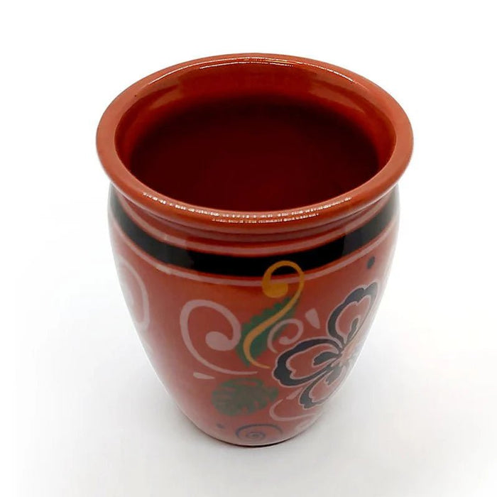 Ceramic cup with decorative patterns on a white background