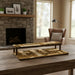Wooden tiered tray on a wooden table with a fireplace and chair in the background