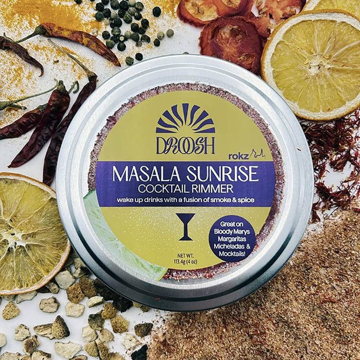 Drosh Masala Sunrise Cocktail Rimmer packaging with ingredients in the background