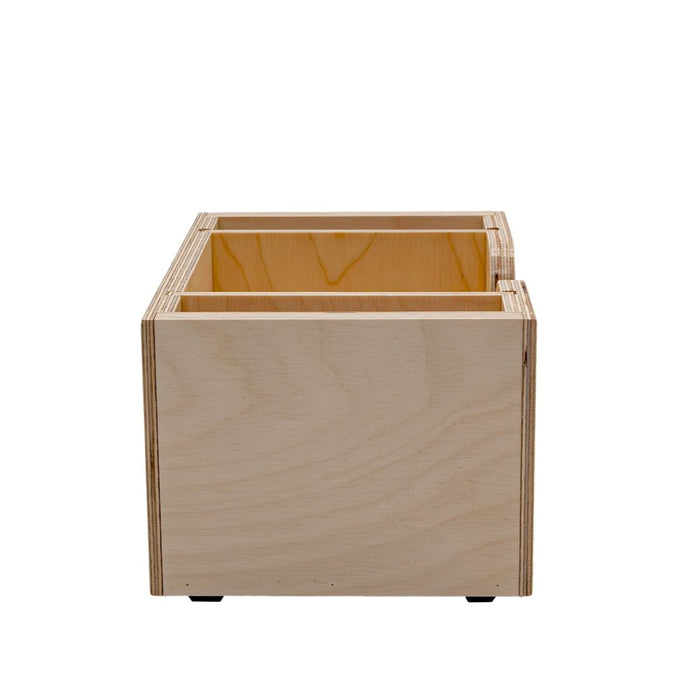 Wooden bar top napkin caddy with two compartments for storage on a white background