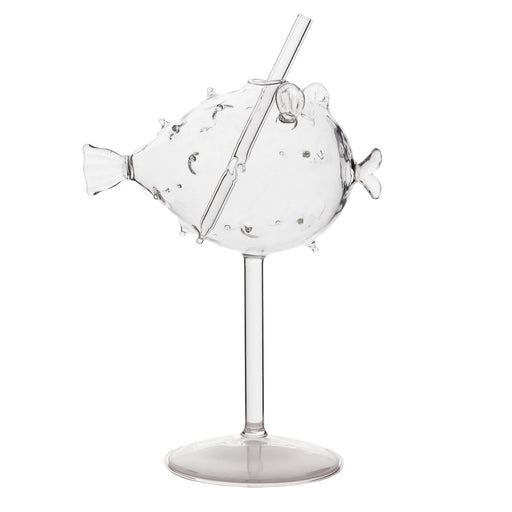 Clear glass fish-shaped cocktail glass with a straw on a white background