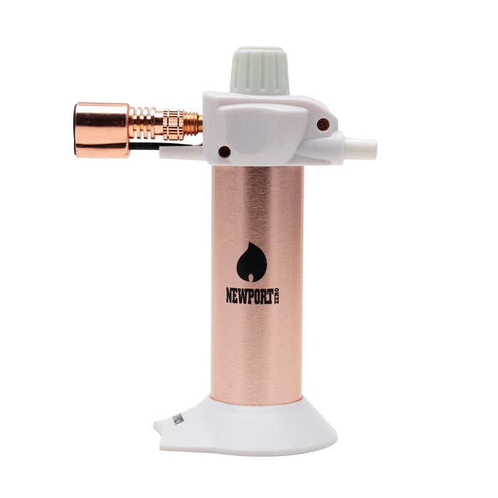 A portable torch lighter with a brushed rose gold body, white plastic top and base, and a copper-colored nozzle, featuring the Newport brand logo.