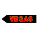 Black arrow-shaped sign with 'VEGAS' in red on a white background