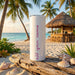 Tumbler with 'add your name' text on a beach setting with palm trees and a hut.