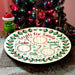 Decorative plate for Santa with Christmas tree and Grinch toy in the background
