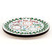 Round tray with Christmas-themed compartments for Santa's treats on a white background