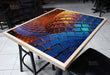Colorful mosaic table with a geometric pattern in a room setting