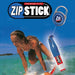 Person surfing with a Zip Stick in the water, featuring the Zip Stick logo.